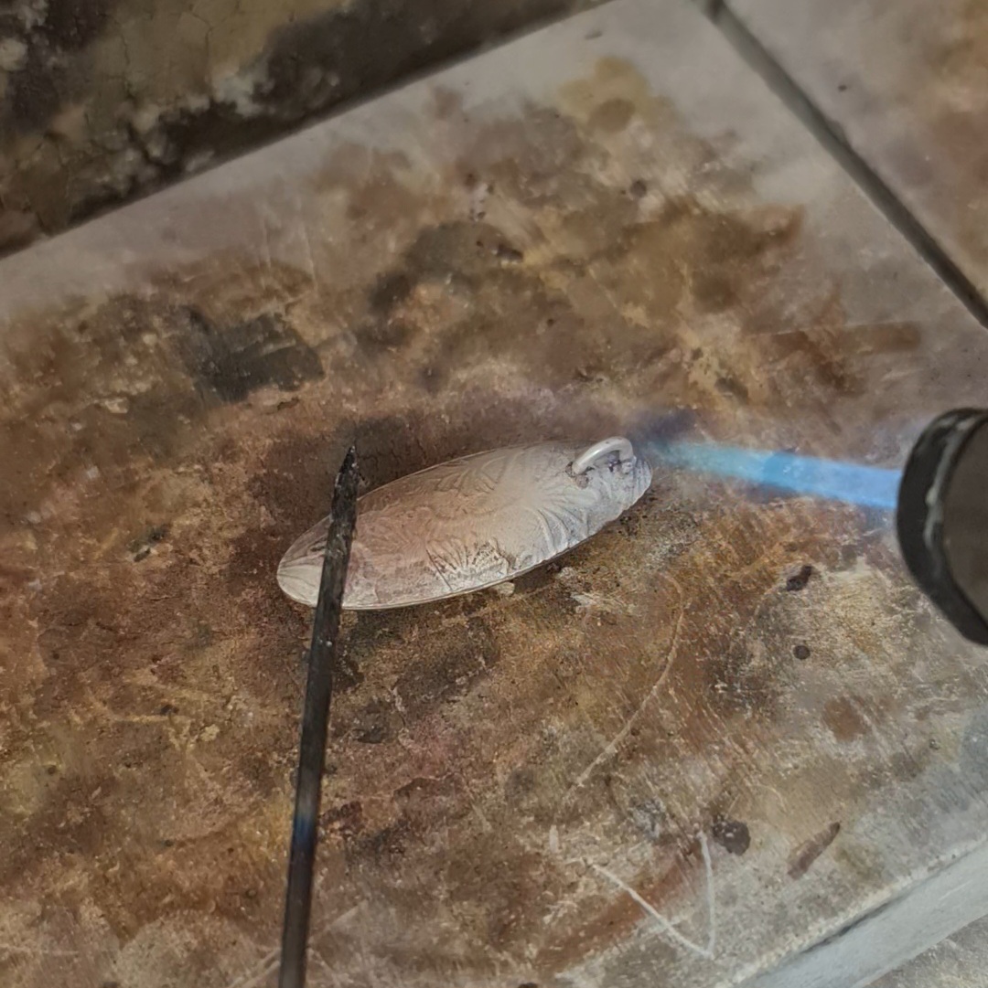 soldering the bail in place